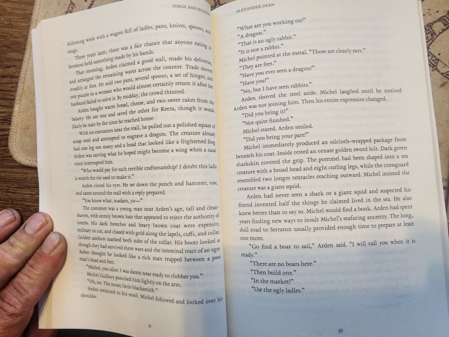 Corrected physical proof of Forge and Shadow open to pages 35 and 36 with the rebuilt inside margins visible